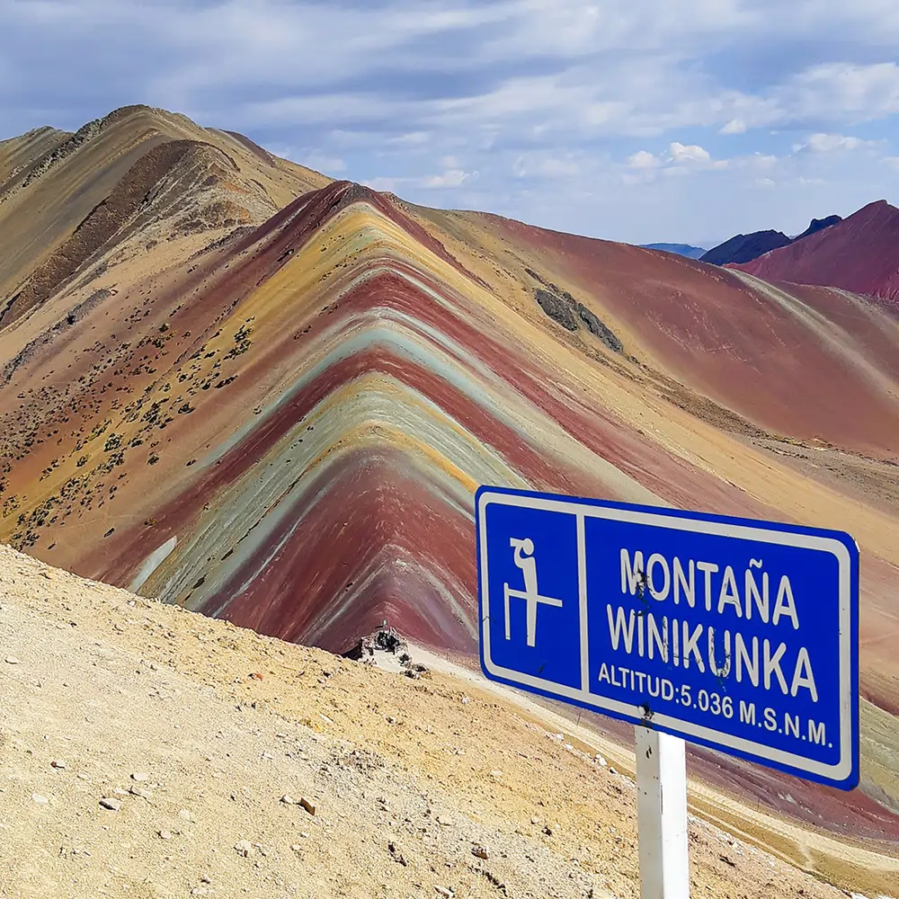 The striped ridge at Vinicunca — the best known of the three Rainbow Mountain Peru options